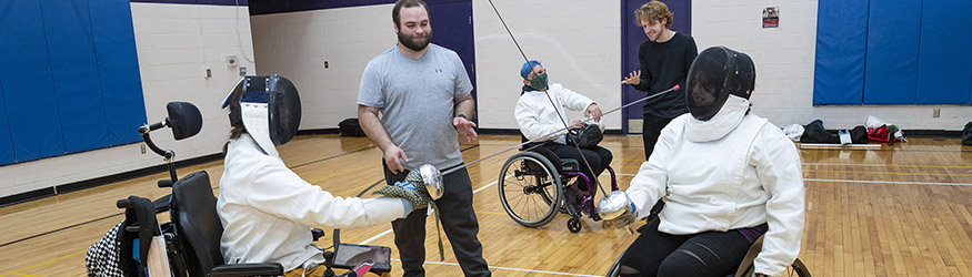 photo of an adapted recreation fencing instructor and students 