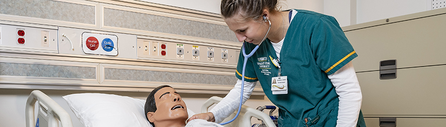 photo of a nursing student in a sim lab