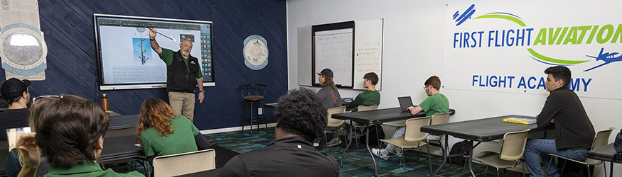 photo of students and an instructor in an aviation class