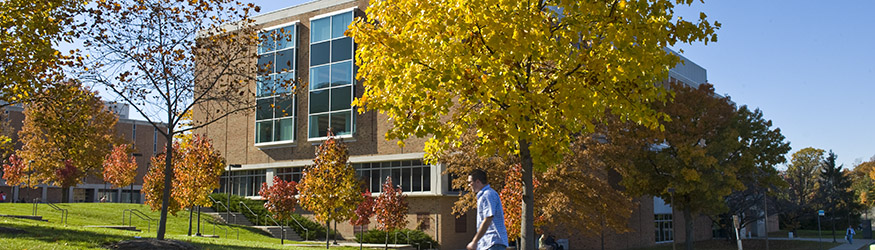 photo of a student walking past millett hall
