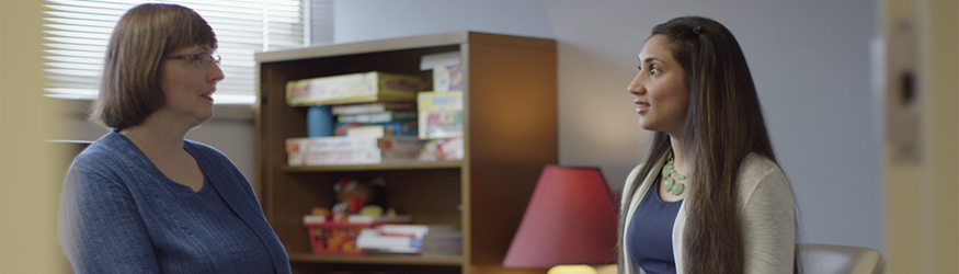 photo of a student and professor in an office