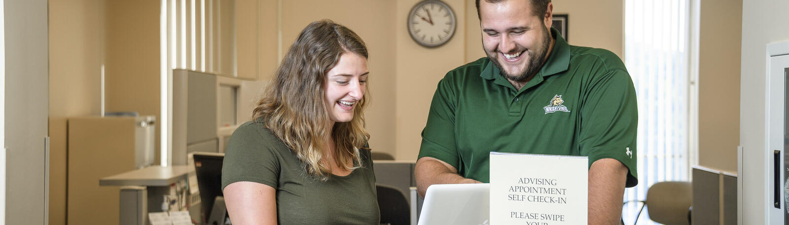 photo of a student and an advisor talking 