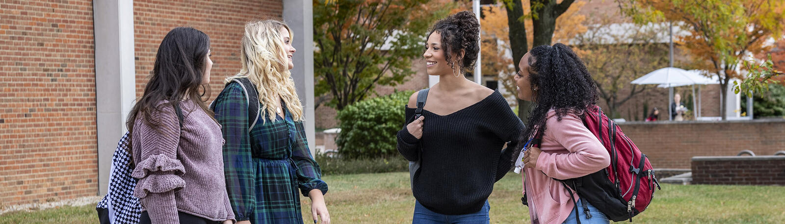 photo of students standing and talking outside on wright state's campus
