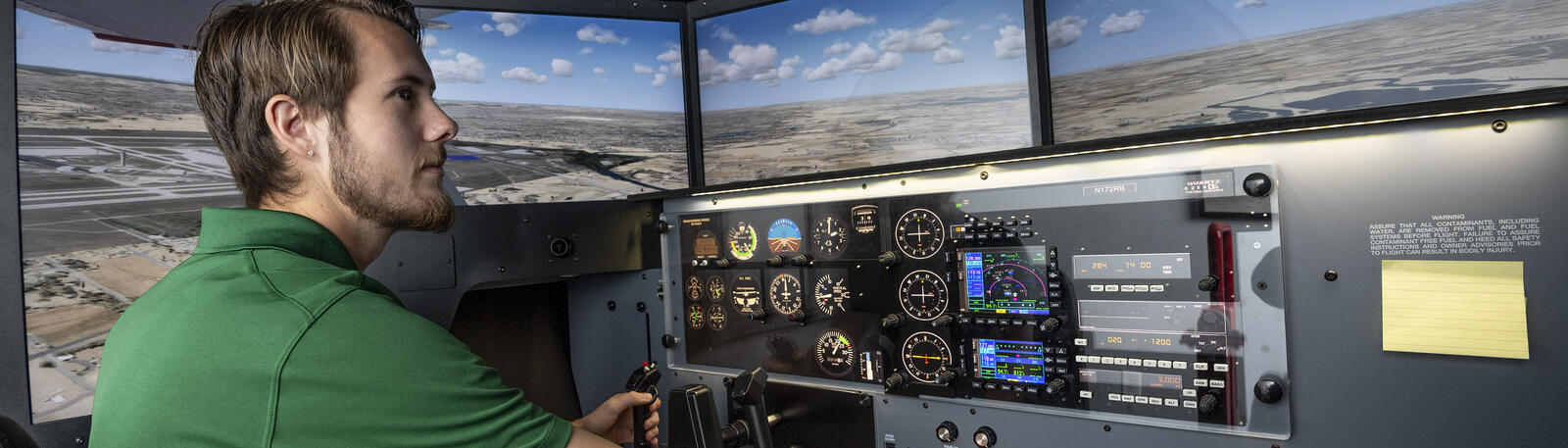 photo of a flight instructor in a flight simulator