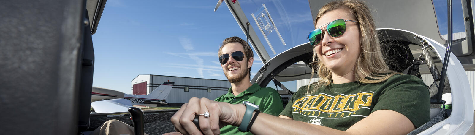 photo of a student and an instructor in a plan