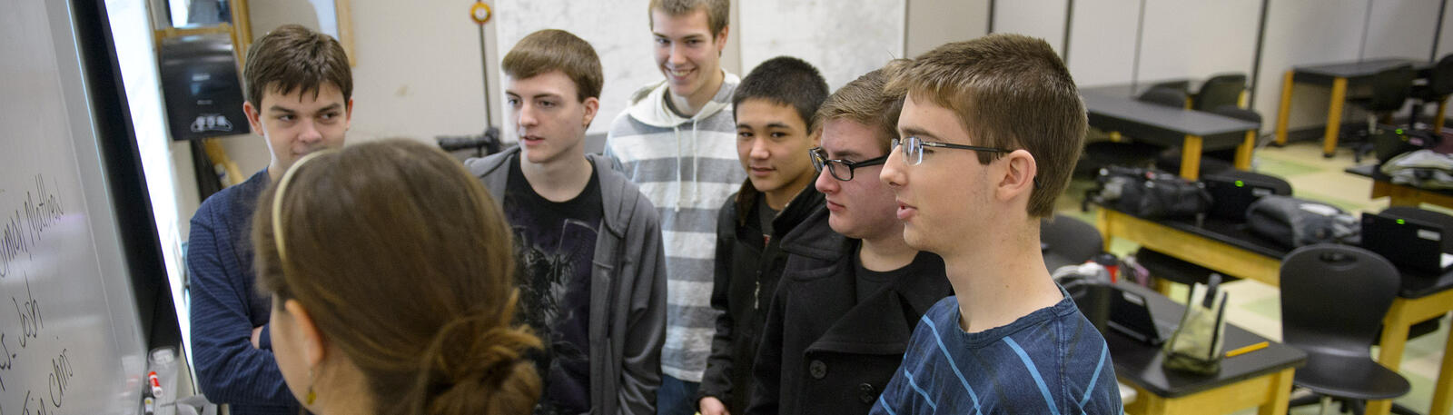 photo of students and a teacher in a classroom