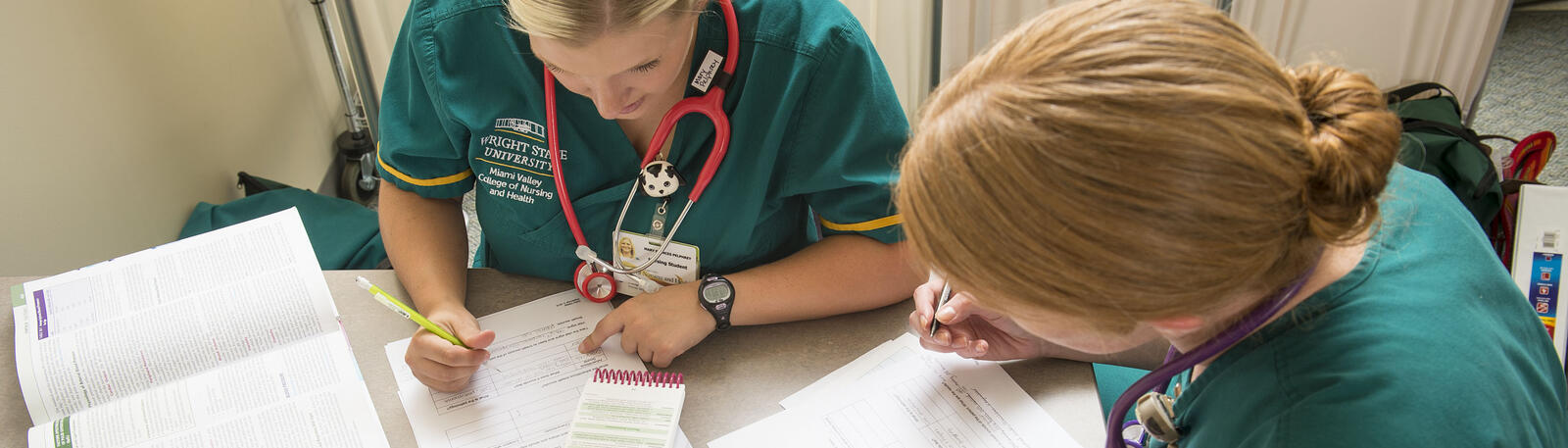 photo of two nursing students studying