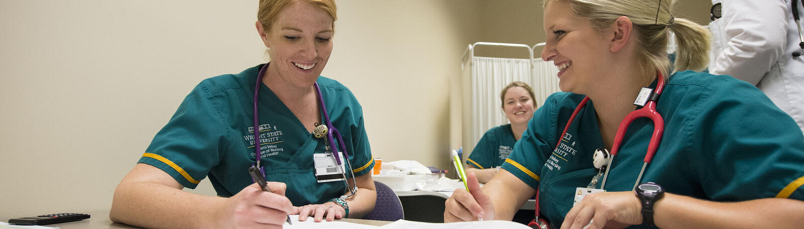 photo of nursing students and an instructor in a lab