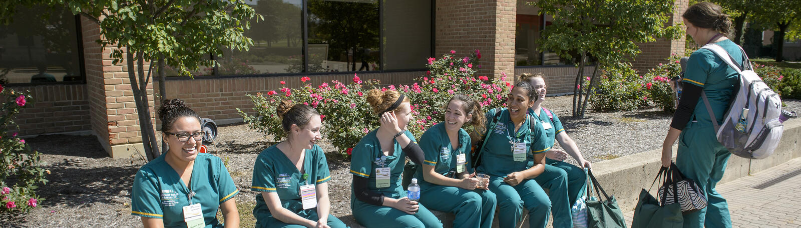 photo of nursing students sitting outside together