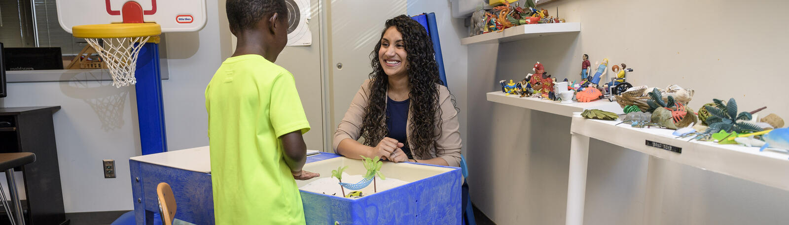 photo of a student and a child