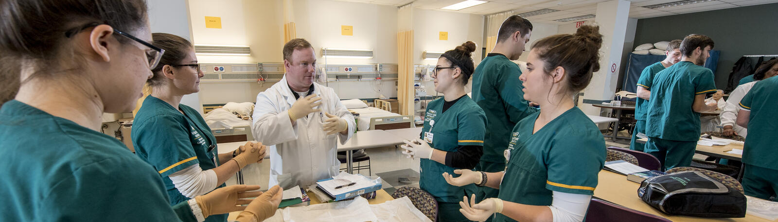 photo of nursing students and an instructor in a lab
