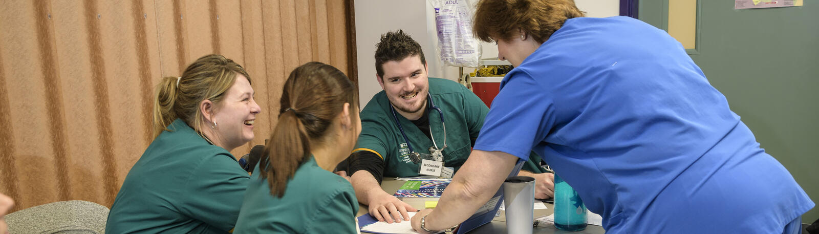 photo of nursing students and an instructor in a lab