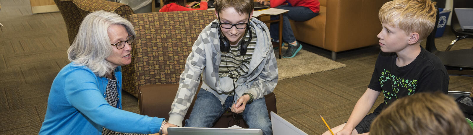 photo of a teacher and students