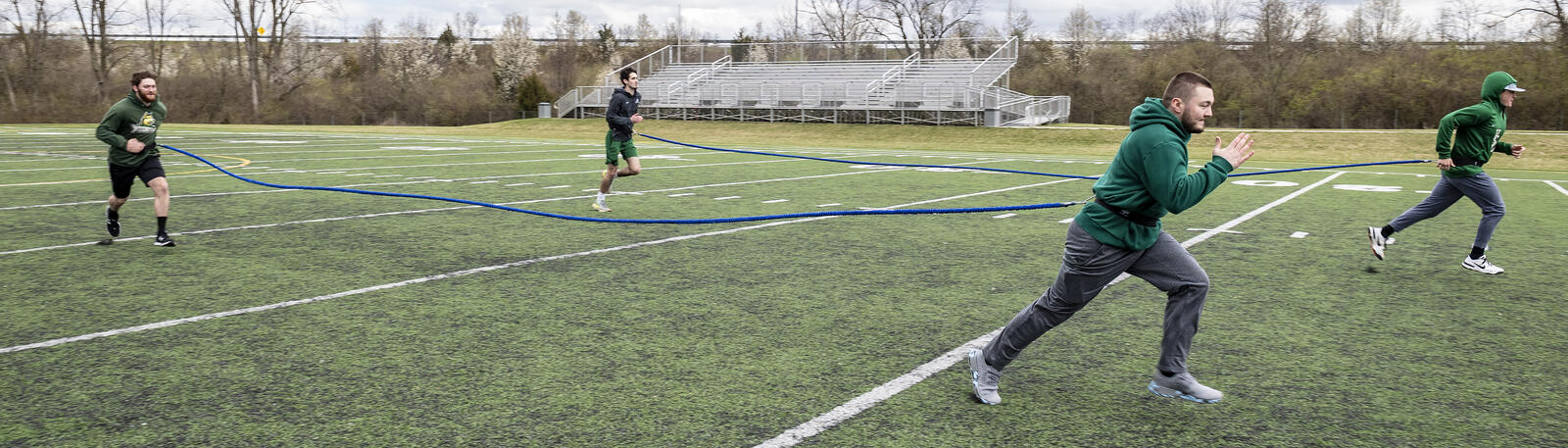 photo of students exercising outside on campus