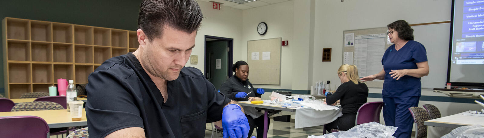 nursing students working in a lab