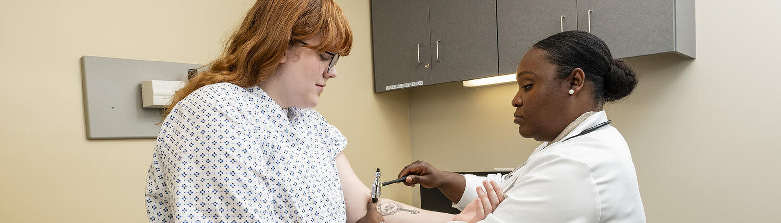 a nurse and patient in an exam room