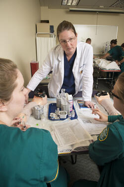 photo of nursing students and an instructor in a lab