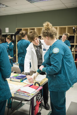 photo of nursing students and an instructor in a lab