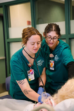 nursing students working in a lab