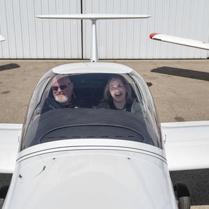 photo of a student and instructor in an airplane