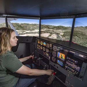 photo of a student in a flight simulator