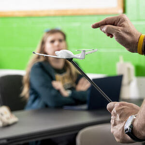 photo of a student and instructor in a class